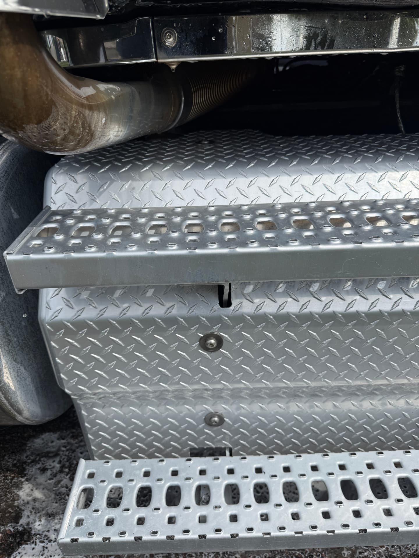 The same aluminum tank and steps polished clean after a hot water wash